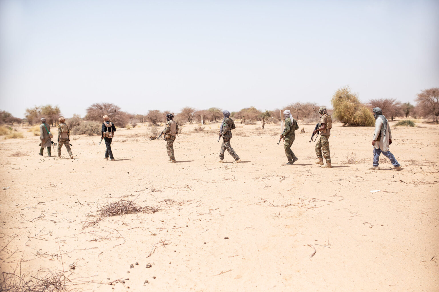 Fighters from the Cheikh Kaci Heirs Battalion of Movement 63 of the Front for the Liberation of Azawad (FLA) advance during a patrol in the Kidal region, northern Mali.© Samir Maouche